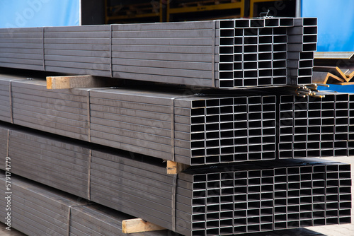 Obraz na płótnie Metal profile pipe of rectangular cross section in packs at the warehouse of met