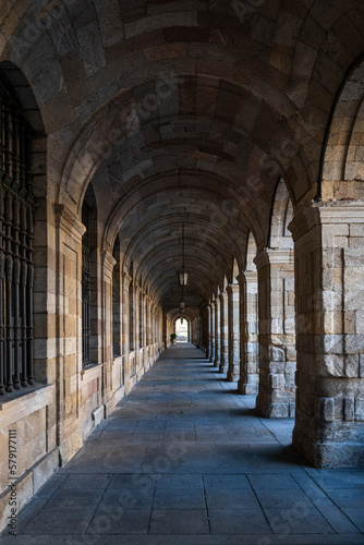 Inside the narrow stone arcades in the old town of Santiago de Compostela in Galicia, Spain.