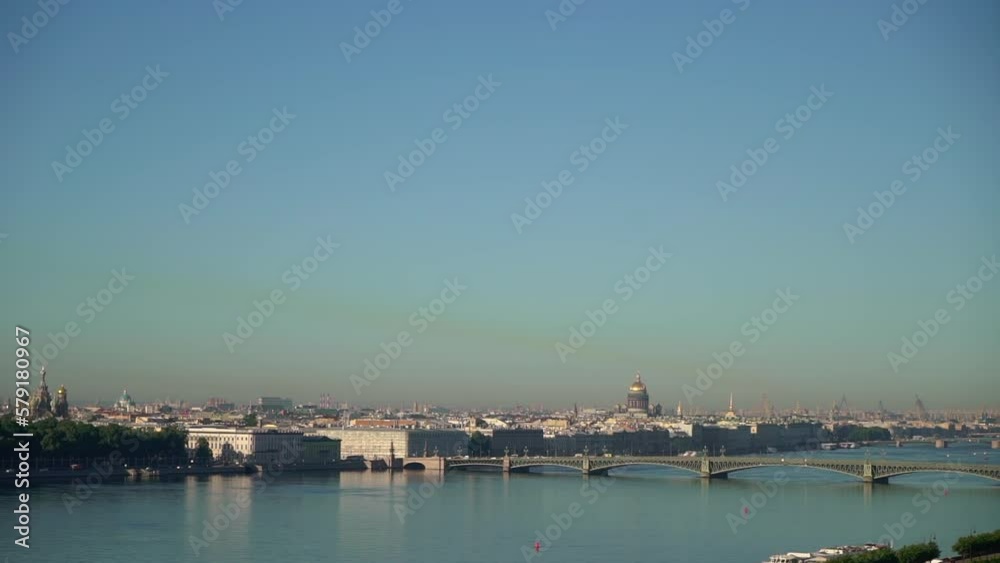 View of the city from above. Saint-Petersburg, Russia. Neva river, city embankment, road with car traffic, bridges. View of the city from above. Saint-Petersburg, Russia. Neva river, city embankment, road with car traffic, bridges.