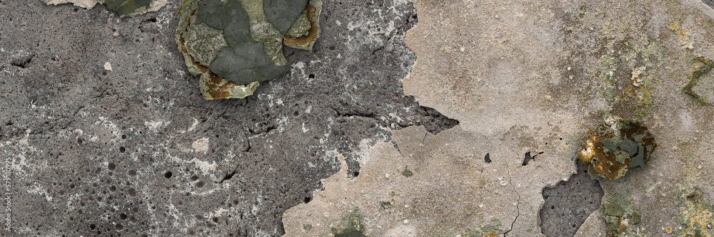 Peeling paint on the wall. Panorama of a concrete wall with old cracked flaking paint. Weathered rough painted surface with patterns of cracks and peeling. Wide panoramic grunge texture for background Peeling paint on the wall. Panorama of a concrete wall with old cracked flaking paint. Weathered rough painted surface with patterns of cracks and peeling. Wide panoramic grunge texture for background