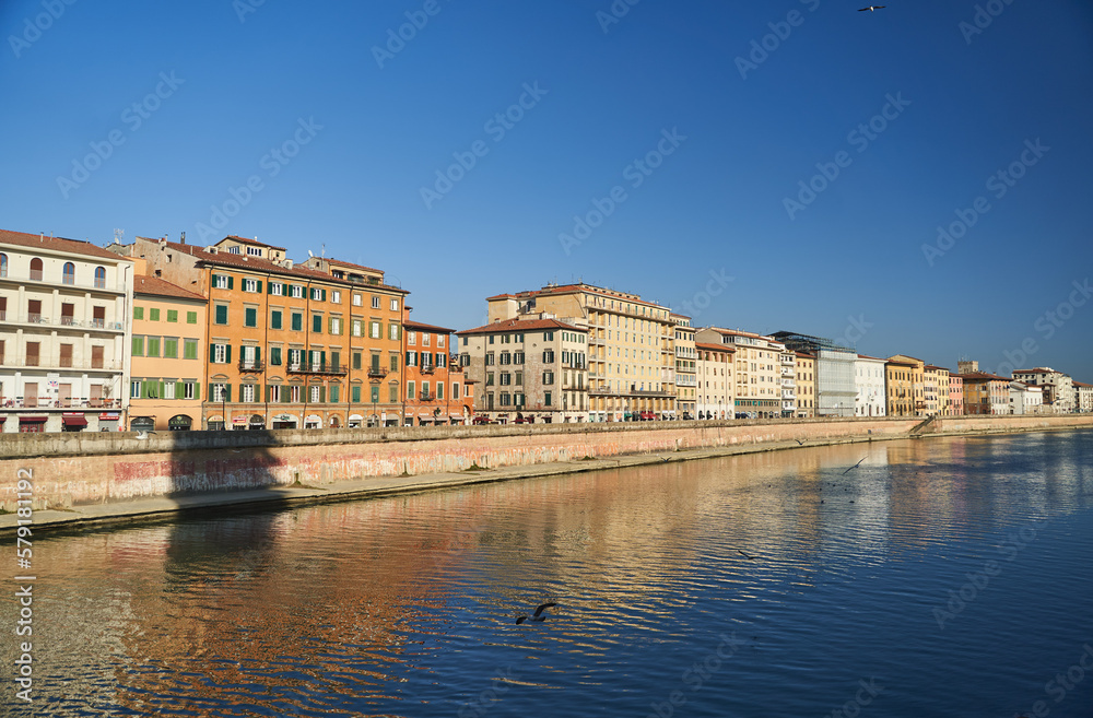 Cityscape with Pisa old town and Arno river in Tuscany, Italy. High quality photo