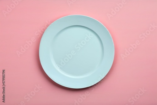 light blue porcelain plate isolated on pink background