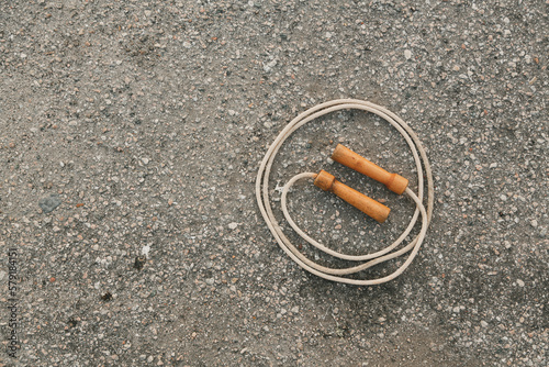 Single Coiled Jump Rope on Concrete Road photo