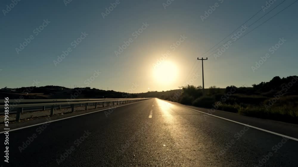 Drive on mountain road with black asphalt and fresh white markings. Travel by car, first-person view. POV transportation drive forward. Sun shine in camera. Drive on mountain road with black asphalt and fresh white markings. Travel by car, first-person view. POV transportation drive forward. Sun shine in camera.
