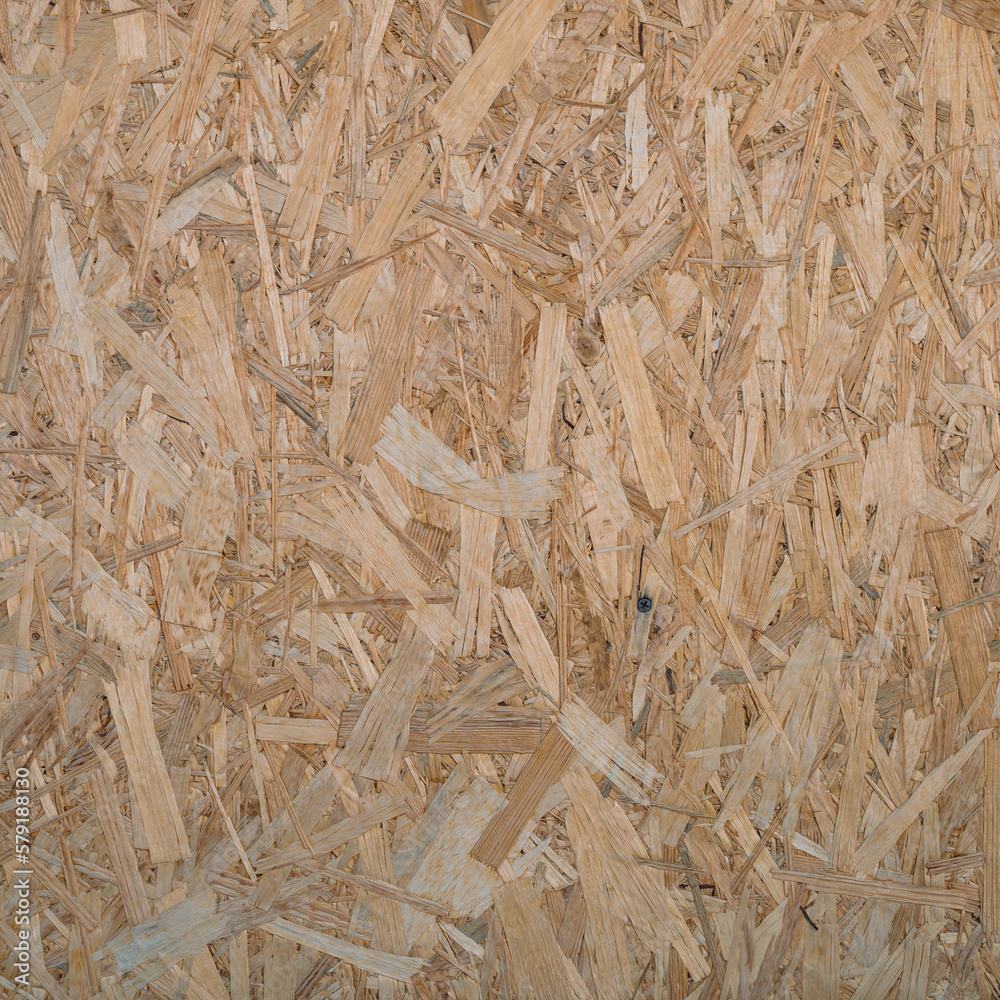 Minimal backdrop with pattern of natural pressed sawdust close-up. Minimalist background with sheet of plywood with compressed sawdust fragment. Wooden texture template close up. Minimal backdrop with pattern of natural pressed sawdust close-up. Minimalist background with sheet of plywood with compressed sawdust fragment. Wooden texture template close up.