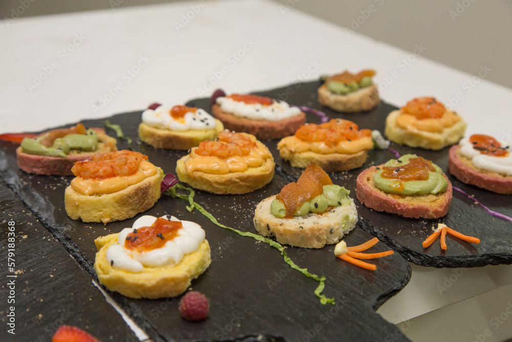 Sophisticated plate of food prepared to be served at a large event.
