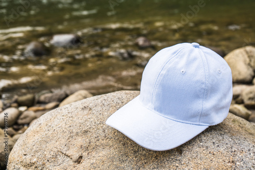 With its clean and stylish design, this white cap hat provides the perfect accessory for a day spent relaxing by the river
