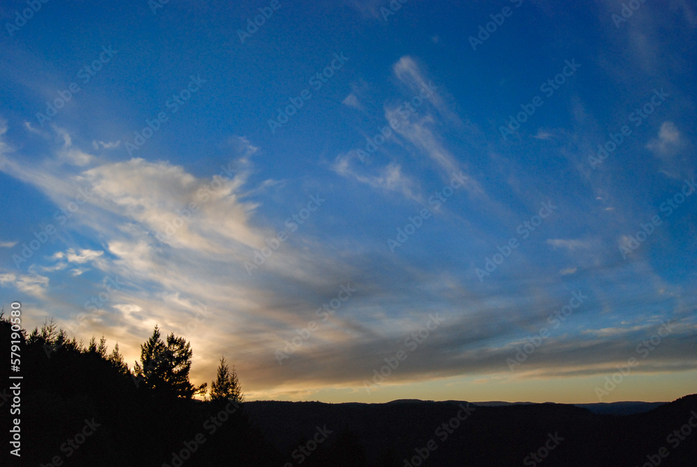 Sunset colours in the clouds as seen from a lookout in Gowland Todd Provincial Park, Vancouver Island, British Columbia, Canada