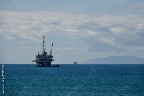 oil rig platform with cranes out at sea
