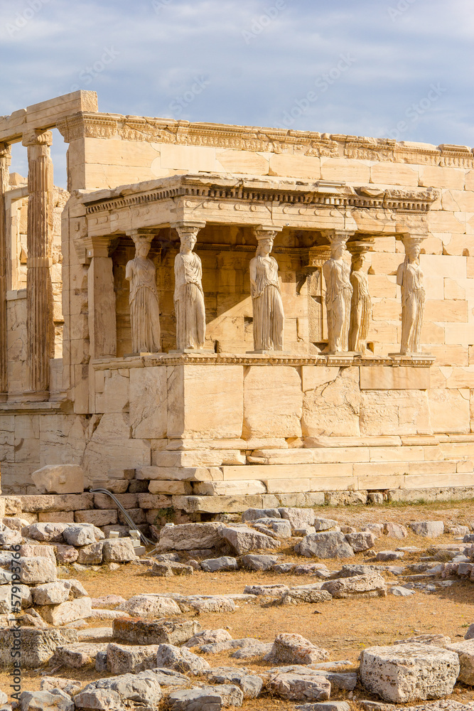 The Erechtheion or Temple of Athena Polias, the Ancient Greek temple at the Acropolis in Athens. The columns that support the porch are six female figures.