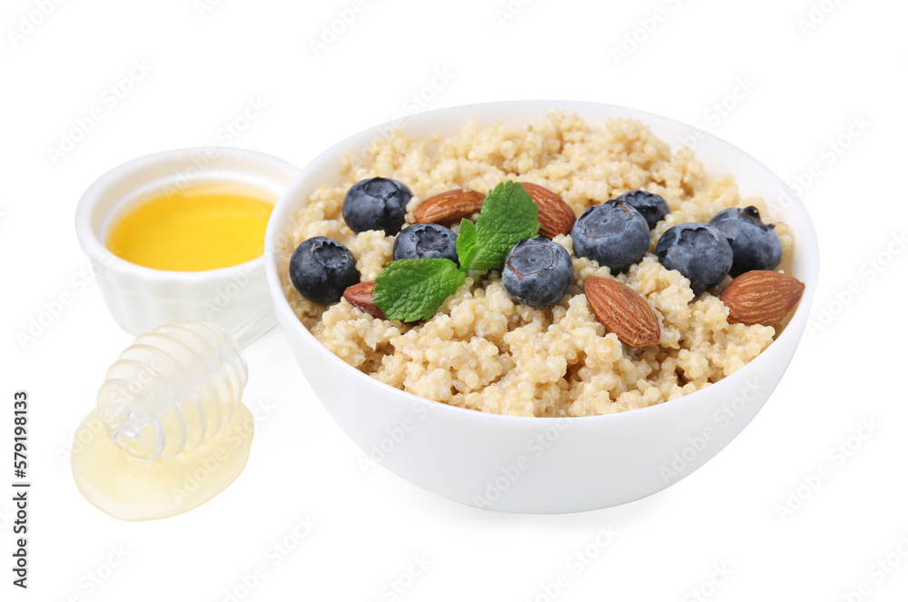 Bowl of delicious cooked quinoa with almonds, honey and blueberries on white background Bowl of delicious cooked quinoa with almonds, honey and blueberries on white background