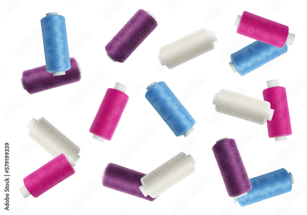 Many colorful sewing threads falling on white background Many colorful sewing threads falling on white background