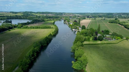 Smooth 4k drone footage flying over the river Thames from Marlow towards Bourne End Buckinghamshire UK