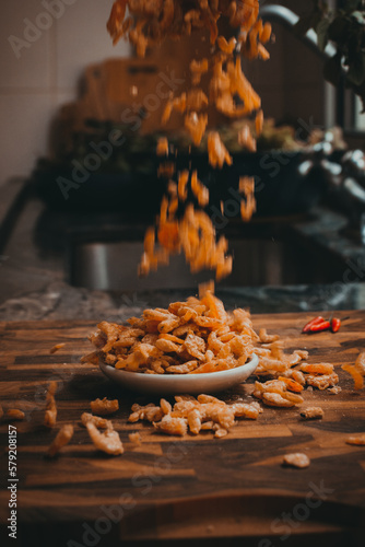 Falling Dried Shrimp on Wooden Board with Plate of Dried Shrimp