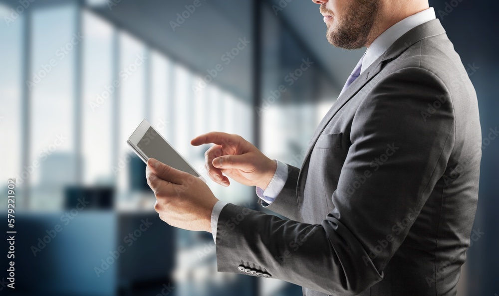 Young business person hold digital tablet at office Young business person hold digital tablet at office