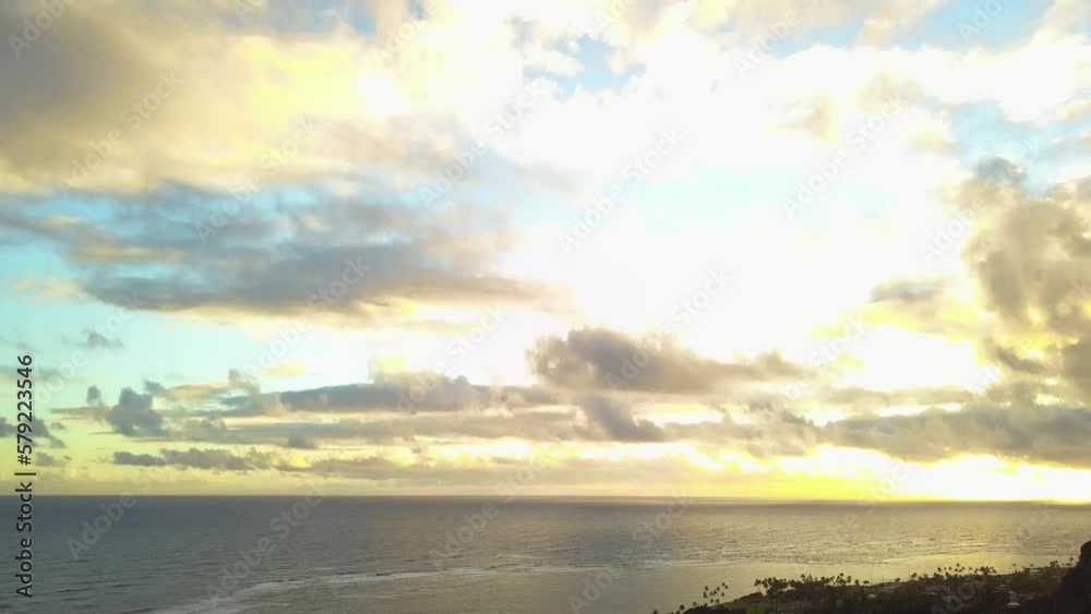two people overlooking a radiant sunset on Crouching Lion Hike in honolulu hawaii - AERIAL DOLLY TILT two people overlooking a radiant sunset on Crouching Lion Hike in honolulu hawaii - AERIAL DOLLY TILT