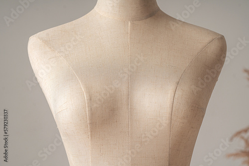 Vintage mannequin without hands on a light studio background photo