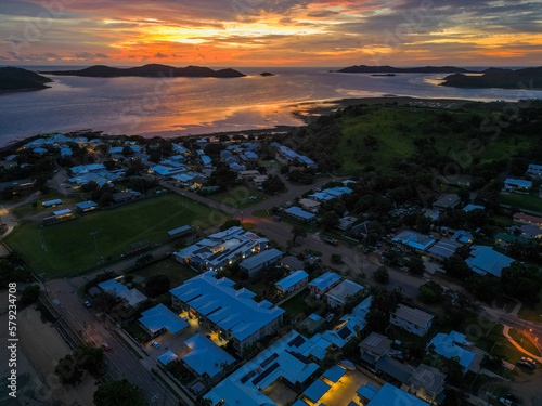 Aerial sunset showing the beach and town of Torres Strait, Thursday island