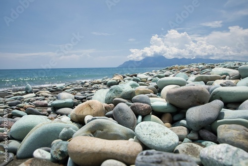 Close-up of blue stones on the beach of Pantai Batu Biru, the Blue Stone Beach, in Ende on Flores.