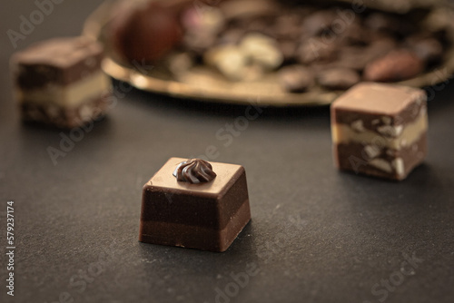 Superfood chocolates, pralines on dark background