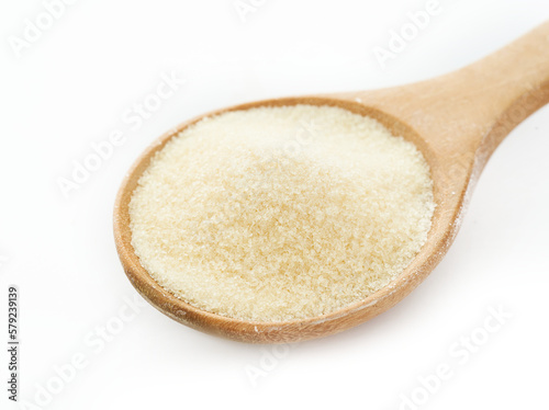 gelatin powder in wood spoon isolated on white background. pile of gelatin powder in wood spoon isolated. gelatin powder in wood spoon isolated 