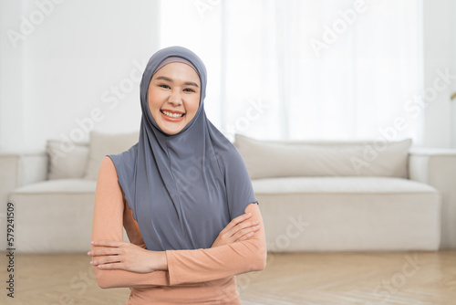 Photography Beautiful smiling Asian young muslim woman wear hijab standing with crossed arms