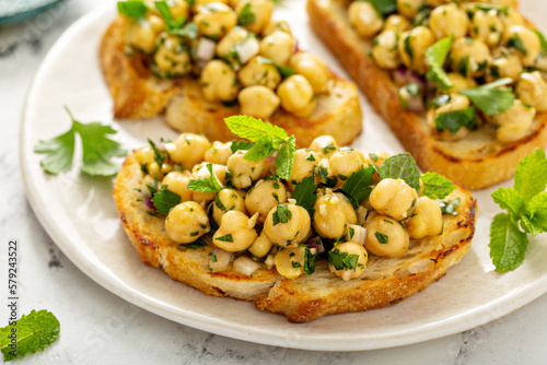 Fotobehang Healthy bruschetta with chickpea salad and herbs