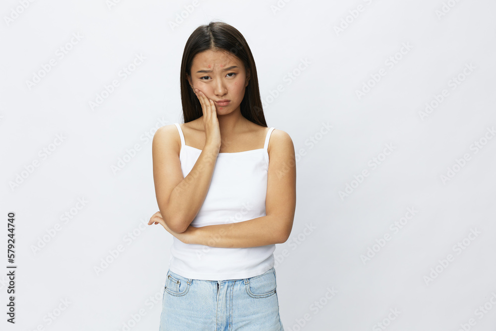 Asian woman facial skin problems, acne and inflammation, red rashes and allergies, chicken pox, sadness from rashes. Facial skin care concept for diseases and nerves Asian woman facial skin problems, acne and inflammation, red rashes and allergies, chicken pox, sadness from rashes. Facial skin care concept for diseases and nerves