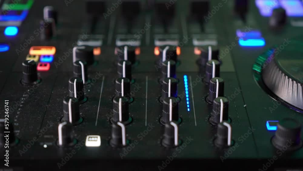Professional sound console, DJ mixer. Close-up equipment for a concert, party in a nightclub. Professional sound console, DJ mixer. Close-up equipment for a concert, party in a nightclub.