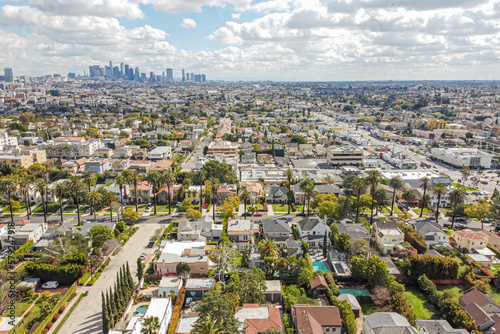 Los Angeles, California – February 26, 2023: aerial city view drone photo toward Downtown LA above Olympic Blvd Koreatown LA showing many homes, apartments, photo