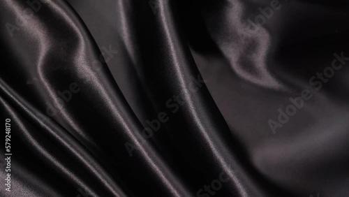 動くブラックのサテン布　スローモーション　ハイスピード撮影　背景素材