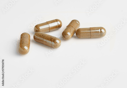 Close up, herbal capsules isolated on a white background.