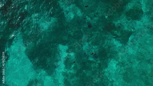 Beautiful low to mid altitude drone view of Lake Attersee, Upper Austria, Europe, on a dark, cloudy, cold early spring day - camera looks down, then pans up to horizon flying forward