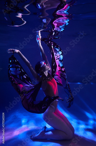 beautiful cosplay girl in a butterfly costume with wings fantasy cyberpunk