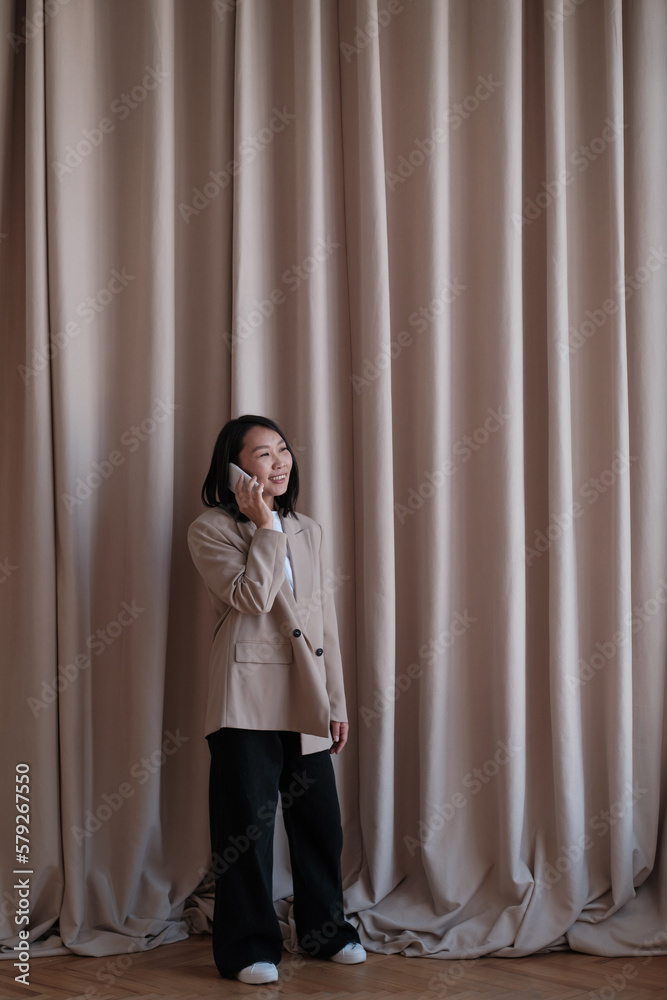 Portrait of a happy asian businesswoman using mobile phone Portrait of a happy asian businesswoman using mobile phone