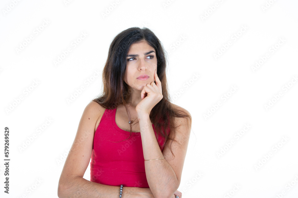 pensive woman look side hand finger on chin aside copy space isolated on white background pensive woman look side hand finger on chin aside copy space isolated on white background