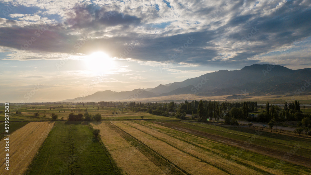 Autumn sunset of mountains and fields from a bird's eye view