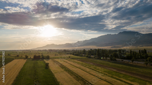 Autumn sunset of mountains and fields from a bird s eye view