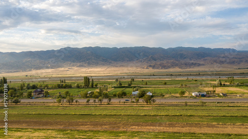 Fotografi Mountains and fields in autumn from a bird's eye view