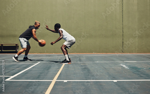 Exercise, sports and basketball friends training at basketball court for health, cardio and speed challenge. Fitness, energy and men practice skill together, having fun and enjoying workout with ball