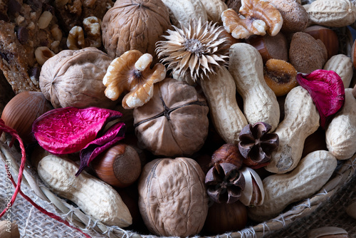 Beautiful basket of nuts such as walnuts, peanuts, almonds and hazelnuts