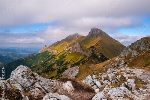 Amazing sunrise in a mountain saddle with rocks and majestic mountains in the background. Autumn sunrise in the mountains. Vysoke Tatry, Slovakia, High, Belinanske Tatras,  photo