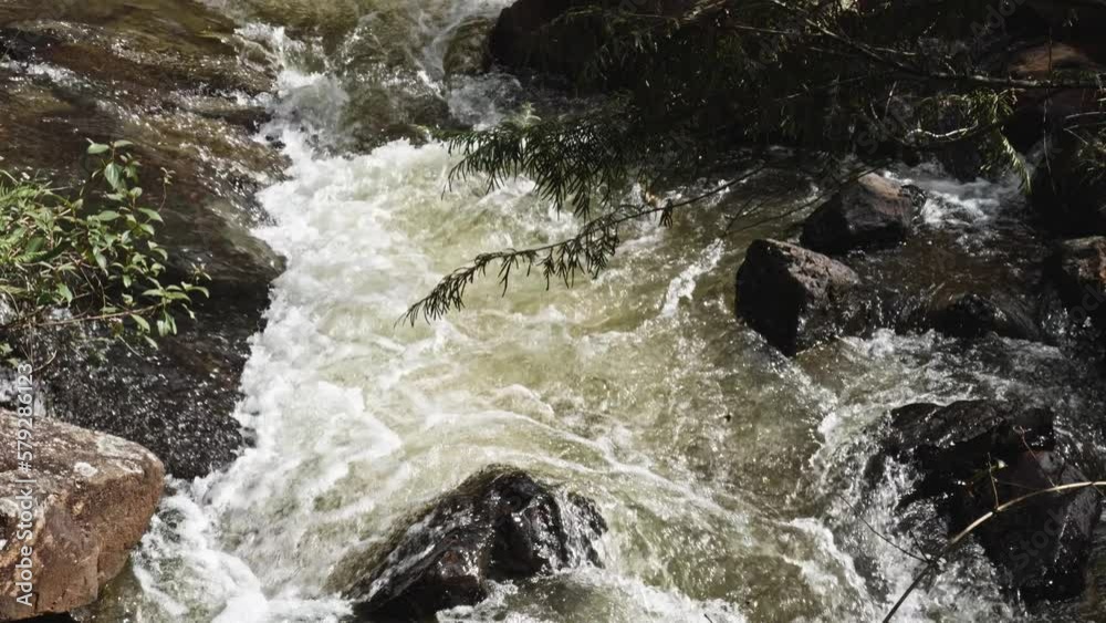 Powerful River Stream Flowing At Datanla Waterfall In Da Lat, Vietnam. Slow Motion tilt up shot Powerful River Stream Flowing At Datanla Waterfall In Da Lat, Vietnam. Slow Motion tilt up shot