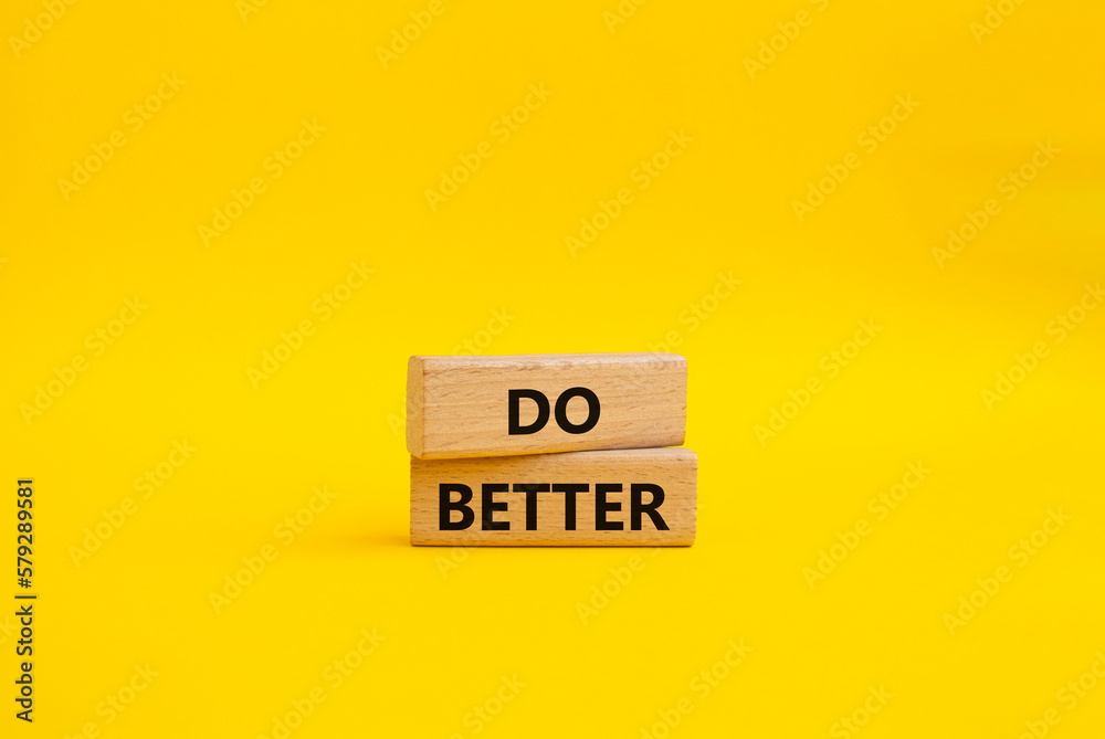 Do better symbol. Wooden blocks with words Do better. Beautiful yellow background. Business and Do better concept. Copy space. Do better symbol. Wooden blocks with words Do better. Beautiful yellow background. Business and Do better concept. Copy space.