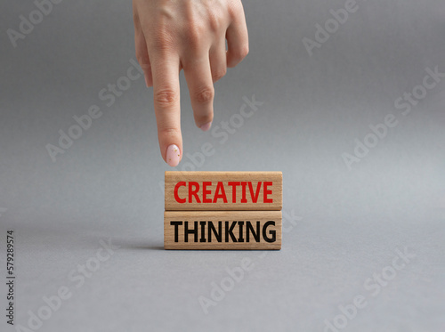 Creative thinkig symbol. Wooden blocks with words Creative thinkig. Businessman hand. Beautiful grey background. Business and Creative thinkig concept. Copy space. photo