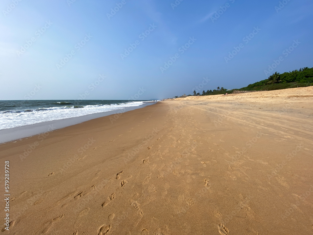 A beautiful beach with no people in the village of Sinquerim in North Goa.