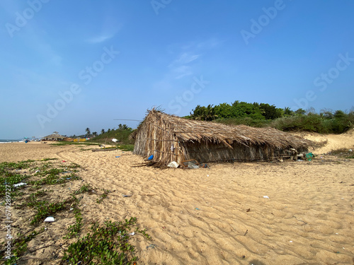 A rustic straw hut at a quiet tropical beach in Sinquerim.
