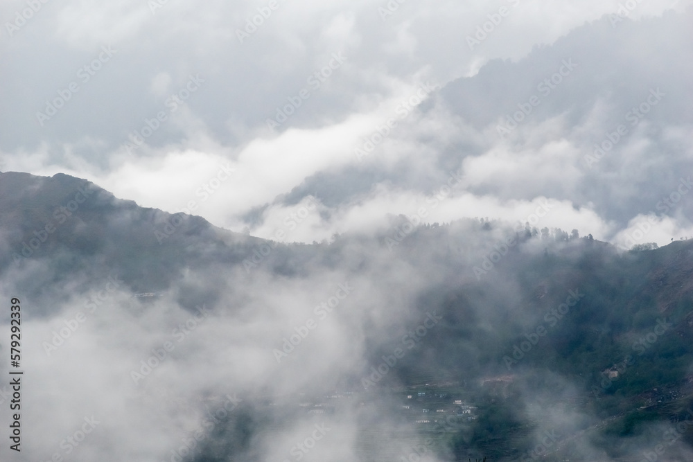 Mist and fog enveloping hills in the Himalayan village of Munsyari in Uttarakhand. Mist and fog enveloping hills in the Himalayan village of Munsyari in Uttarakhand.
