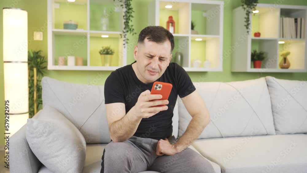 Man experiencing such as blurred vision, severe eye pain