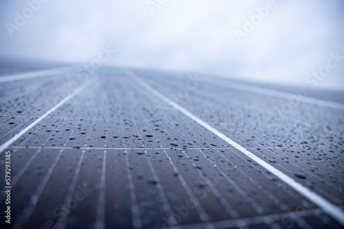 Photovoltaic panel with water pearls on a rainy day 